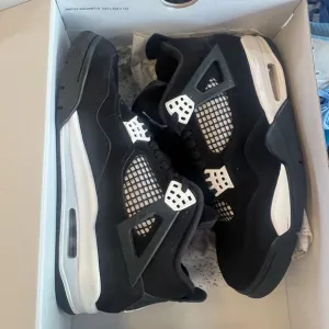 Jordan Black and White Athletic Shoes Air Jordan Retro 4 White Thunder