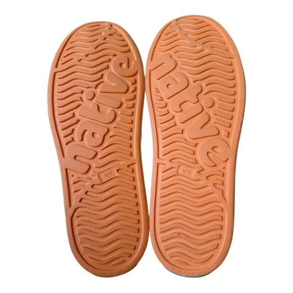 Native Orange and White Loafers size Men's 10 woman's 12.