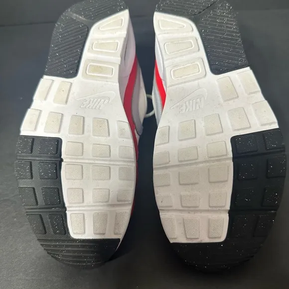 Nike White and Red Sneakers size 6y pre owned Exellent condition.