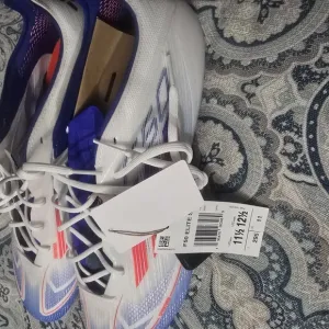 White and Purple Athletic Shoes